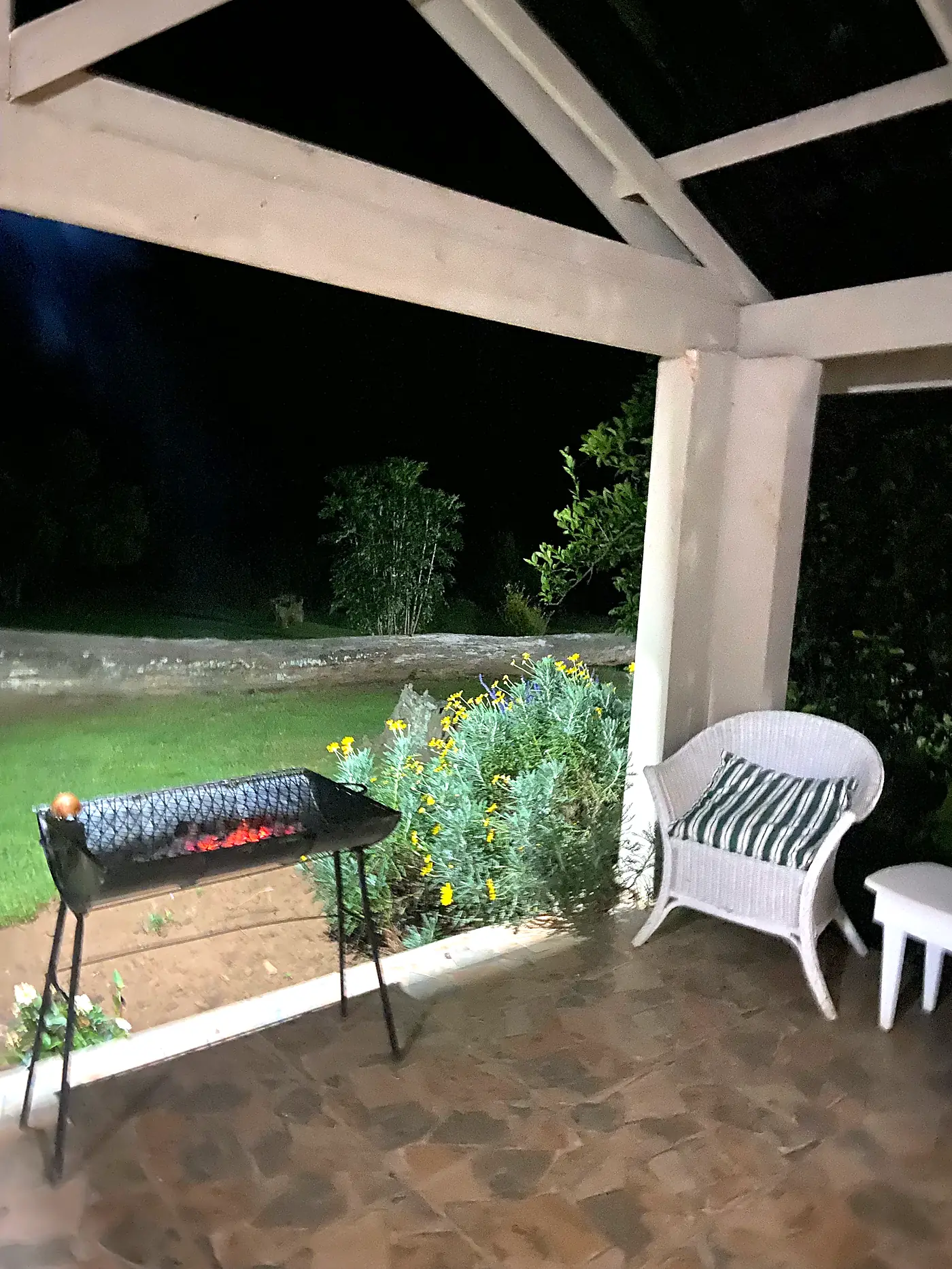 A braai stand on a covered patio